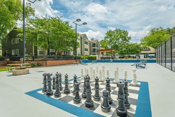 a giant chess board in front of an apartment complex  at Avenues of Kennesaw East & West, Kennesaw Georgia